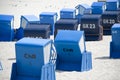 Blue canopied beach chairs at Baltic Sea