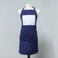 Blue canvas apron uniform on mannequin for designer. Housewife costume for cooking or cleaner