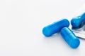 Blue capsule pills white background Copy space Royalty Free Stock Photo
