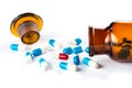 Blue capsules and red capsules with bottle, healthcare and medi Royalty Free Stock Photo