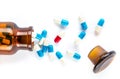 Blue capsules and red capsules with bottle, healthcare and medi Royalty Free Stock Photo