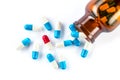 Blue capsules and red capsules with bottle, healthcare and medi Royalty Free Stock Photo