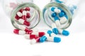 Blue capsules and red capsules with Transparent bottle, healthc Royalty Free Stock Photo