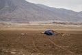 Blue car buried under the earth after a flood in ChaÃÂ±aral, Chile