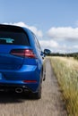 Blue car detail in road with speed blur