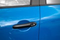 Blue car door handle Royalty Free Stock Photo