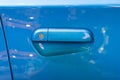 Blue car door lock and handle Royalty Free Stock Photo