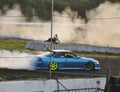 Blue car drifting race track Royalty Free Stock Photo