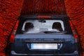 A car inside a car washing machine while it is working Royalty Free Stock Photo
