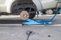 Car jack to lift up pickup truck for remove tire