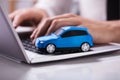 Blue Car On Laptop Keypad Royalty Free Stock Photo