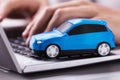 Blue Car On Laptop Keypad Royalty Free Stock Photo