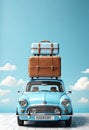 Blue car with luggage on the roof ready for summer vacation with blue sky background copy space Royalty Free Stock Photo