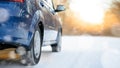 Blue Car Moving Fast on the Winter Snowy Road. Safe Driving Concept. Royalty Free Stock Photo