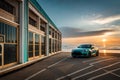 A blue car parked on a beach with a beach house in the background. Royalty Free Stock Photo