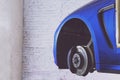 Blue car in the service station for tire, suspension and brakes Royalty Free Stock Photo