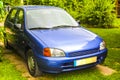 Blue car vehicle parked at the edge of the forest Royalty Free Stock Photo