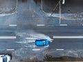Blue car on wet street after heavy rain. aerial view Royalty Free Stock Photo