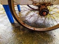 Blue cart with rusty wheels