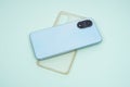 Blue case and transparent case for iPhone, isolated on blue background. Royalty Free Stock Photo