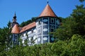 Blue castle and green trees in Olimje