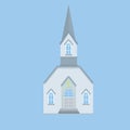 Blue Catholic Church with a spire and a cross. Royalty Free Stock Photo