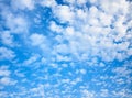 Blue celestial background with white fleecy clouds Royalty Free Stock Photo