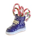Blue ceramic boots, sneakers, with christmas, holiday candies, sweets, close up, isolated, white background