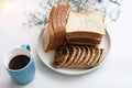 The blue ceramic coffee cup put beside sliced bread dish Royalty Free Stock Photo