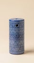 Blue ceramic cylinder with etched geometric tribal pattern Royalty Free Stock Photo