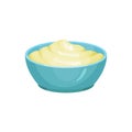 Blue ceramic dip bowl filled with creamy cheese sauce. Delicious cooking ingredient. Traditional garnish for nachos