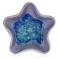 Blue, ceramic, handmade bowl in the shape of a star. At the bottom broken glass with bubbles of air.