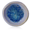 Blue, ceramic, handmade round bowl. At the bottom broken glass w
