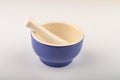 Blue ceramic spice mortar with pestle on white background. Close up Royalty Free Stock Photo