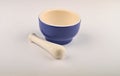 Blue ceramic spice mortar with pestle on white background. Close up Royalty Free Stock Photo