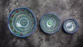 Blue ceramics dish with white floral ornament in Central Asian style. Ethnic Uzbek ceramics