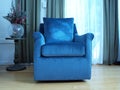 Blue Chair In Room With Soft Lighting
