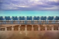 Blue chairs along the Promenade des Anglais on the Mediterranean Sea at Nice, France Royalty Free Stock Photo