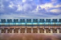 Blue chairs along the Promenade des Anglais on the Mediterranean Sea at Nice, France Royalty Free Stock Photo