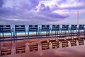 Blue chairs along the Promenade des Anglais on the Mediterranean Sea at Nice, France Royalty Free Stock Photo