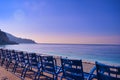 Blue chairs along the Promenade des Anglais on the Mediterranean Sea at Nice, France Royalty Free Stock Photo