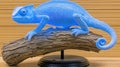 Blue chameleon model on wood, background, studio Royalty Free Stock Photo