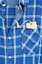 Blue checked shirt with price tag