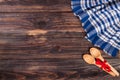 blue checkered tablecloth on the black wooden table with copy space for your text. Top view Royalty Free Stock Photo