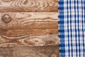 Blue checkered tablecloth on the old wooden table with copy space for your text. Top view Royalty Free Stock Photo