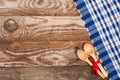 blue checkered tablecloth on the old wooden table with copy space for your text. Top view Royalty Free Stock Photo