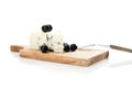 Blue cheese and black olives on cheeseboard