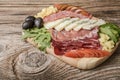 Blue cheese and cold meat platter with salami, slices ham prosciutto, cheese, olives and herbs Royalty Free Stock Photo