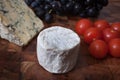 Blue cheese, goats cheese, tomatoes and Sable grapes Royalty Free Stock Photo