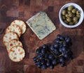 Blue cheese, grapes, crackers and green olives Royalty Free Stock Photo